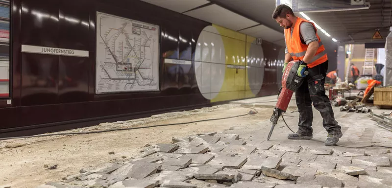 Construction worker with heavy machinery