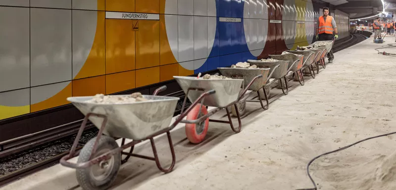Wheelbarrows in a line