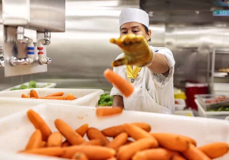 Chef prepares carrots 