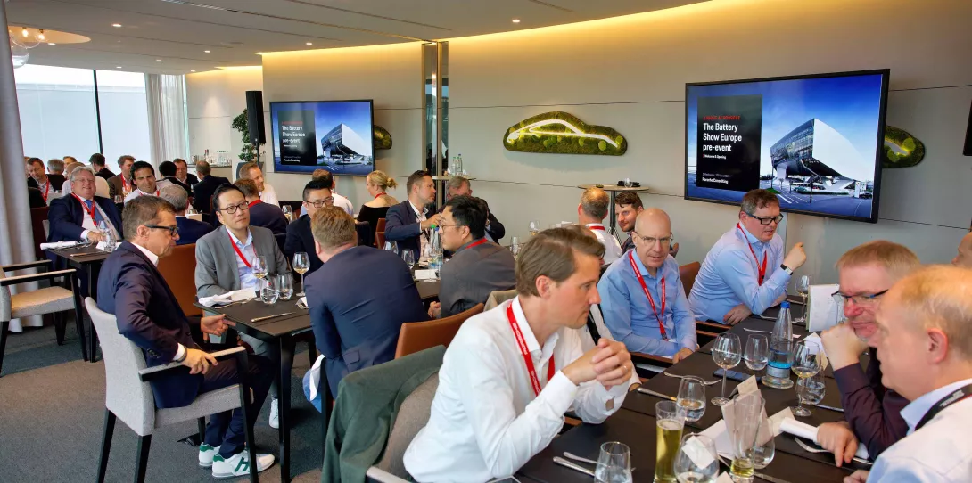 Guests sitting at the battery show europe pre-event hosted by porsche consulting