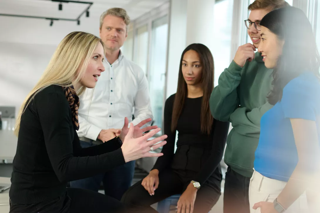 Five consultants in a job discussion