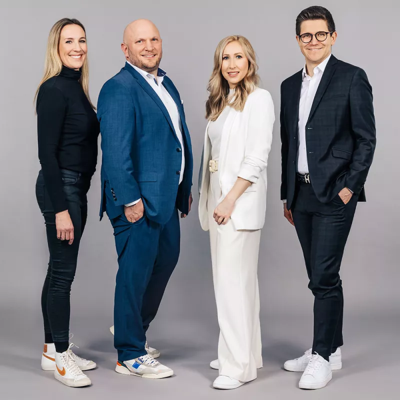 Portrait shot of colleagues from the strategy smiling at the camera